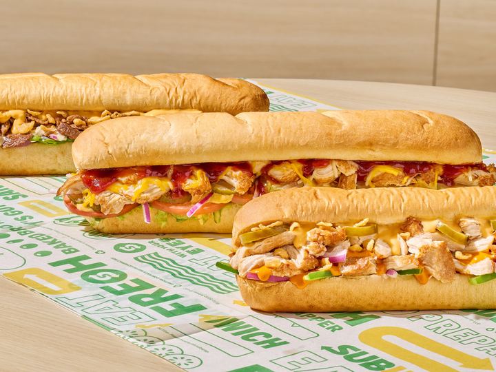 Several footlong submarine sandwiches with fillings